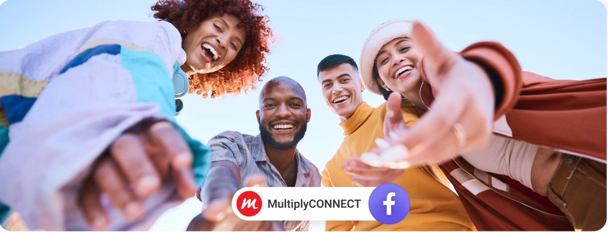 Group of friends reaching down, smiling